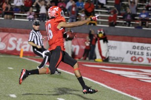 Youngstown State University wide receiver Marcel Caver (16) points toward the end zone after beating the final Illinois State defender to complete a 67-yard touchdown reception with 11:02 left in the second quarter. Caver finished the game with 99 receiving yards during YSU's 59-21 victory over the Redbirds. Photo by Dustin Livesay/ The Jambar.
