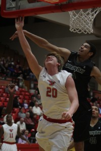 Green Bay's Jordan Fouse blocks Bobby Hain's layup attempt during Thursday night's contest at Beeghly Center. Photo by Dustin Livesay/The Jambar