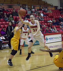 Photo by Dan Hiner/The Jambar Youngstown State University guard Jenna Hirsch (32) gets fouled and makes the layup.