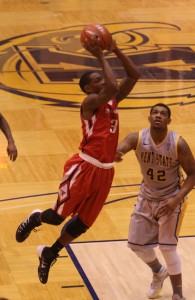 Youngstown State's Kendrick Perry (3) puts up a jump shot while being defended by Kent State's Darren Goodson (42) during the second half of Wednesday night's matchup at Kent State University. Dustin Livesay/The Jambar.